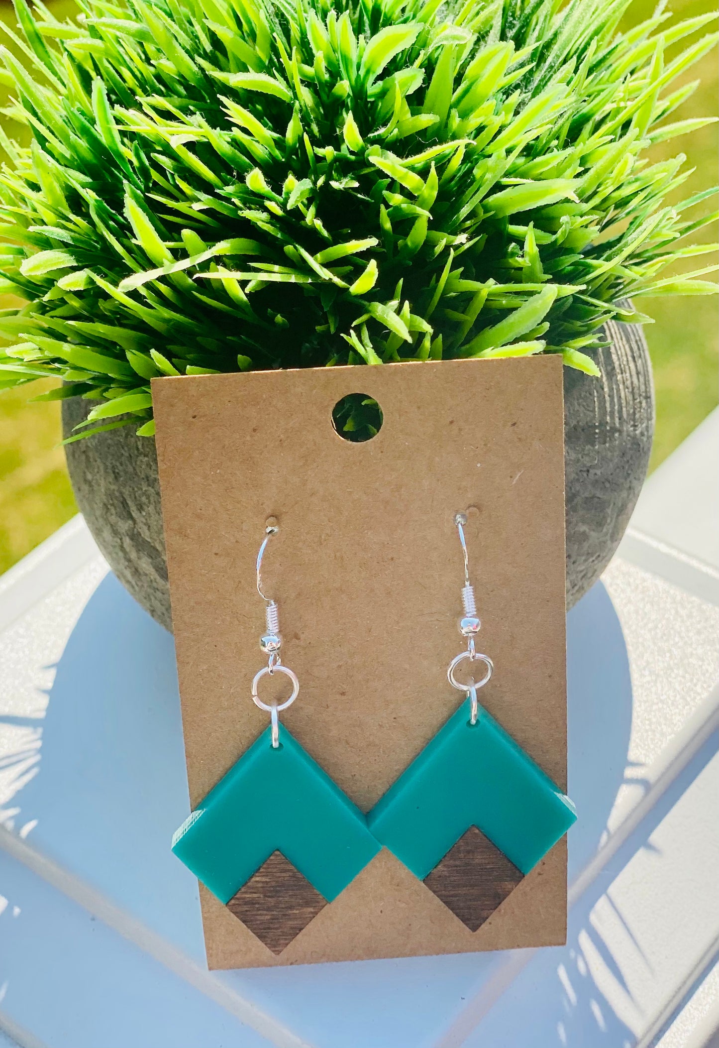 Dark walnut/acrylic teal triangles